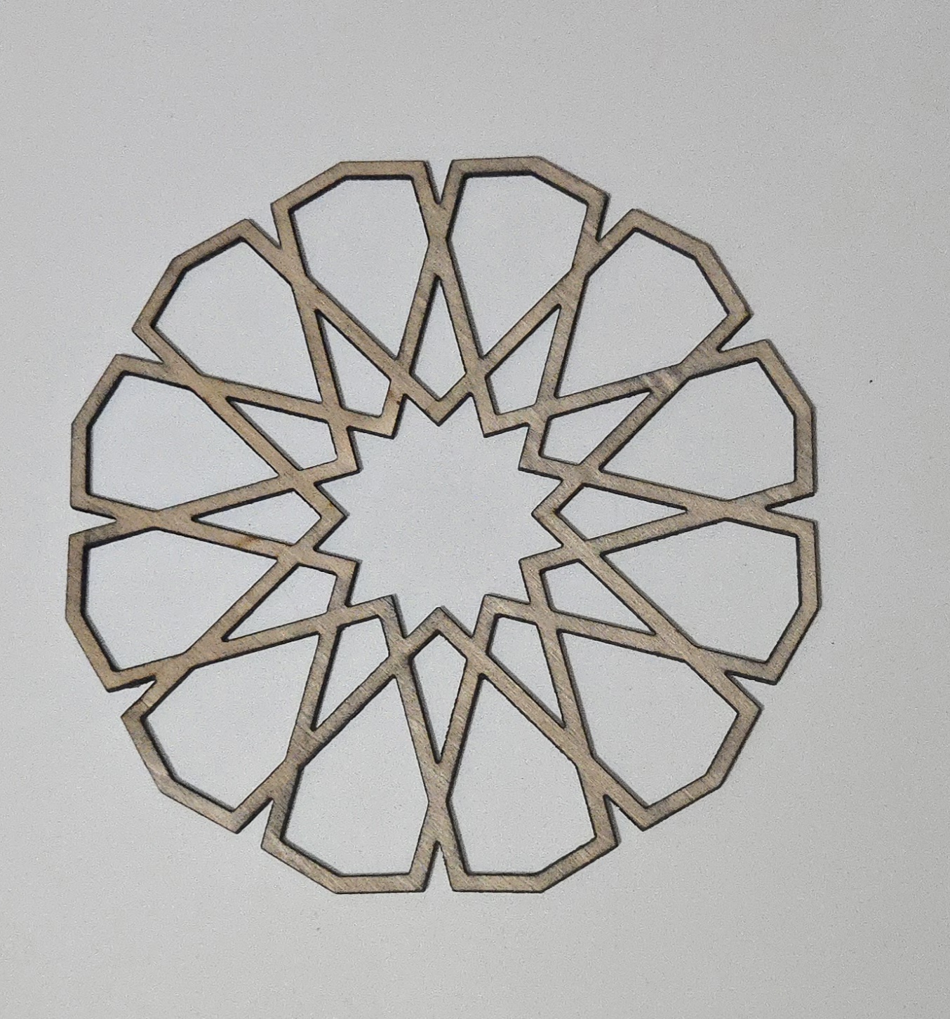Laser-cut wooden Islamic geometric star pattern, decorative art piece by PetiteTrace