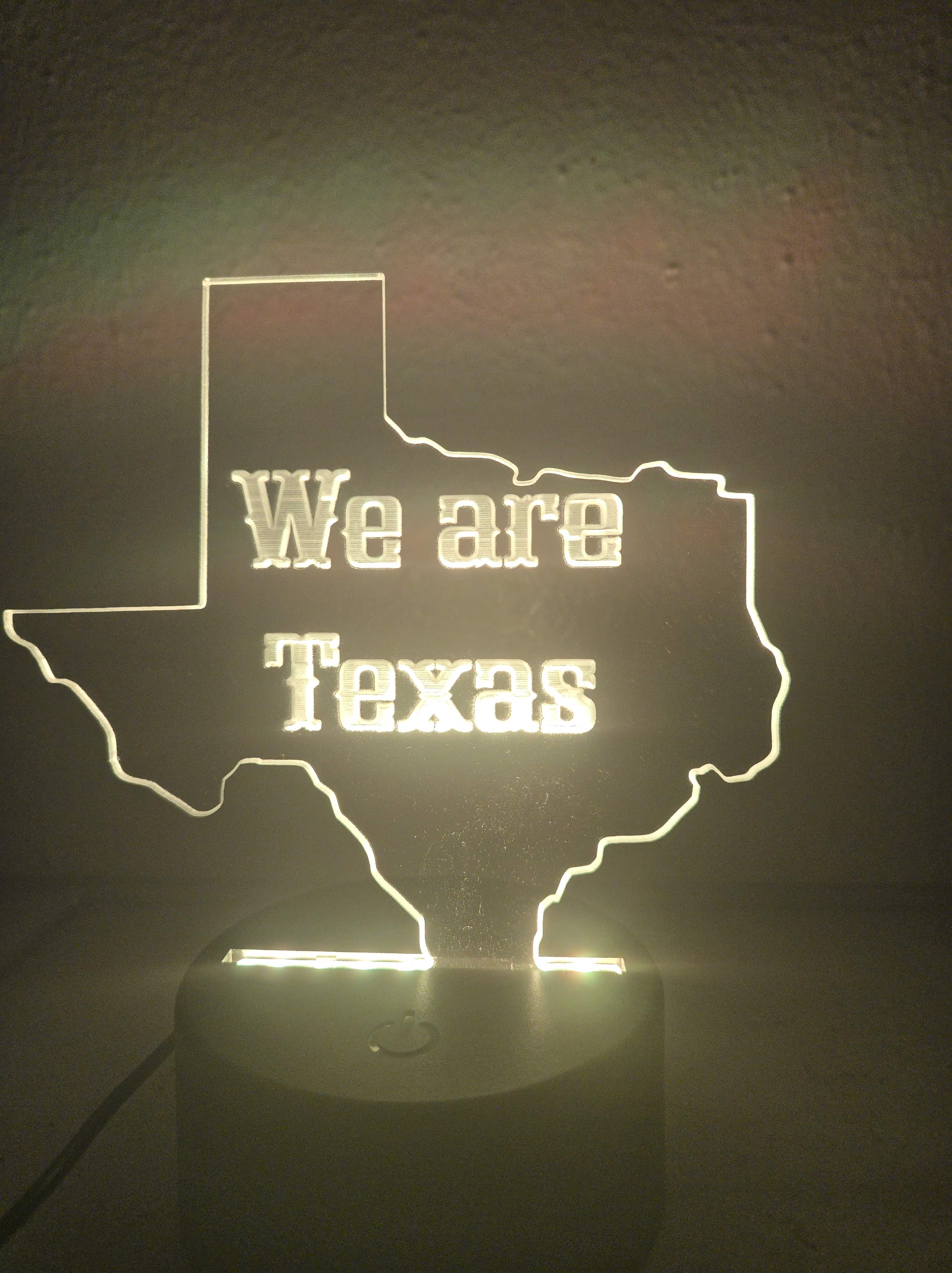 Custom 'We are Texas' LED acrylic night light sign, illuminated in white, by PetiteTrace