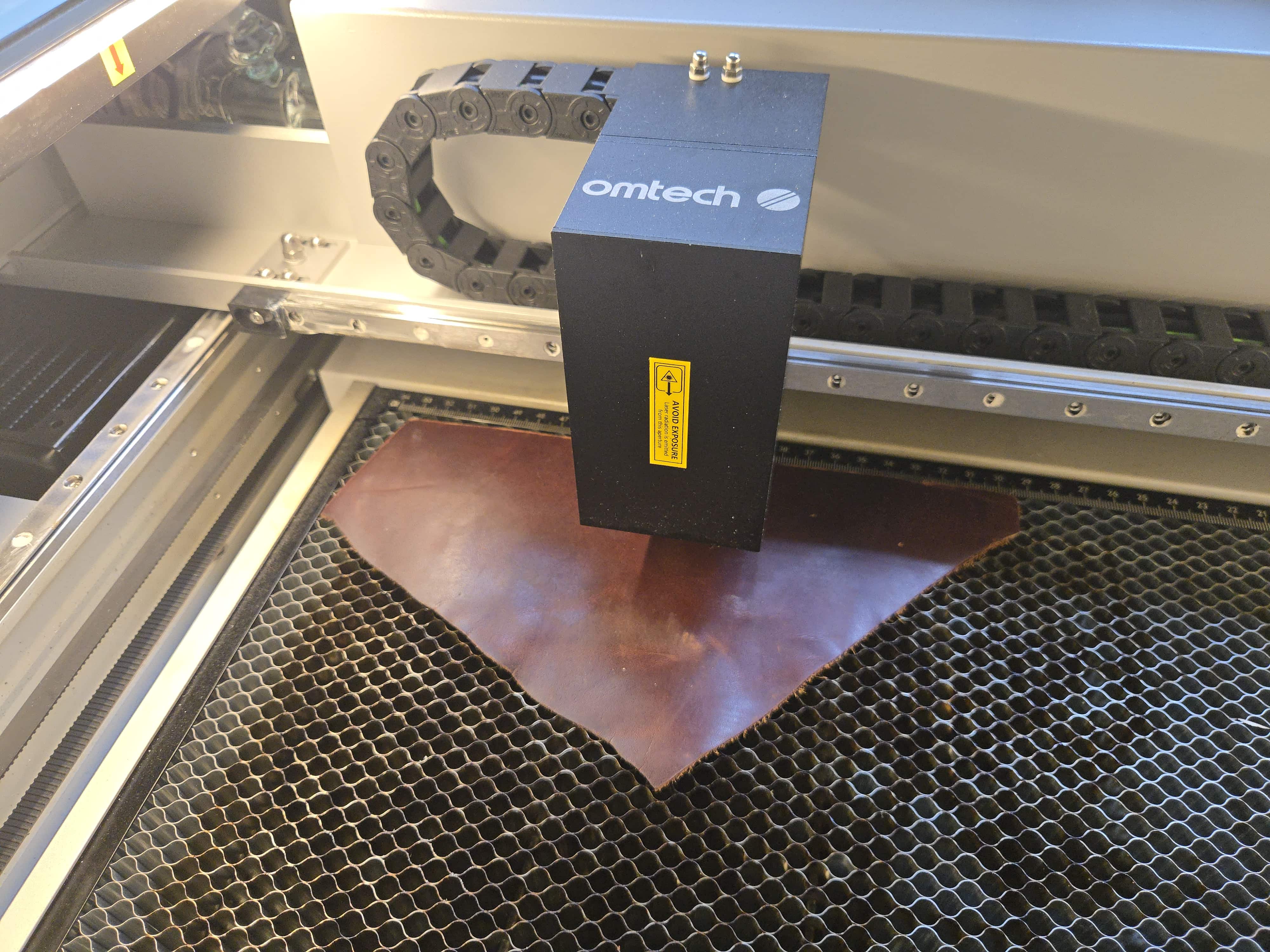 Custom laser-etched leather patches by PetiteTrace